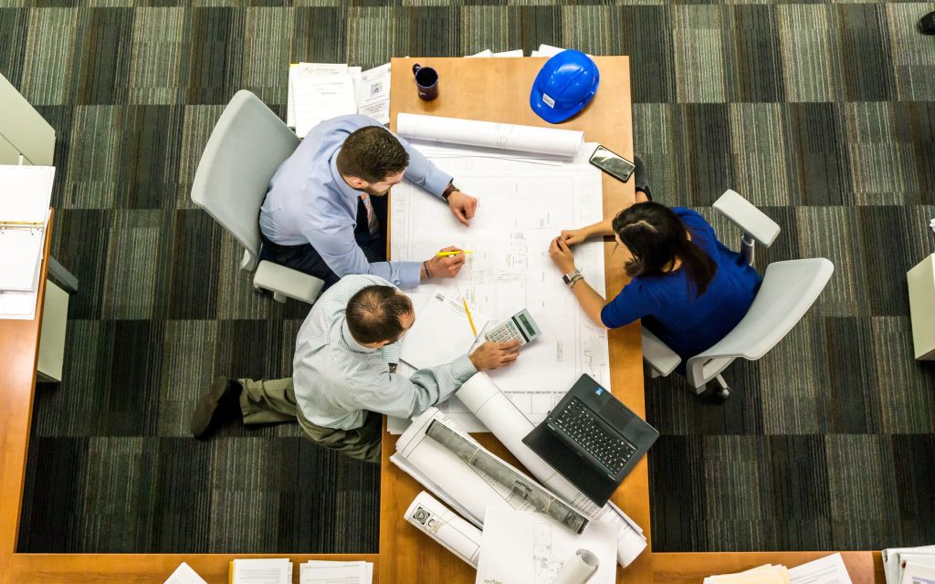 project managers sitting around a desk